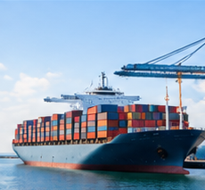Container ship at a commercial seaport for international cargo transportation